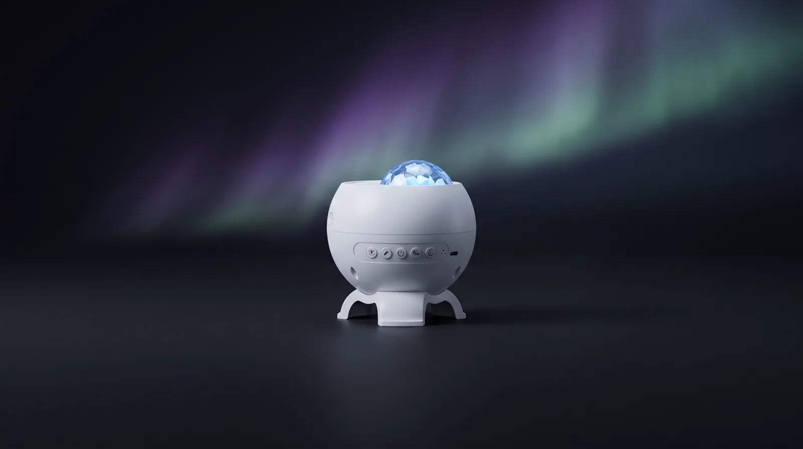 The projector on a bedside surface, aurora drifting across the dark room behind it